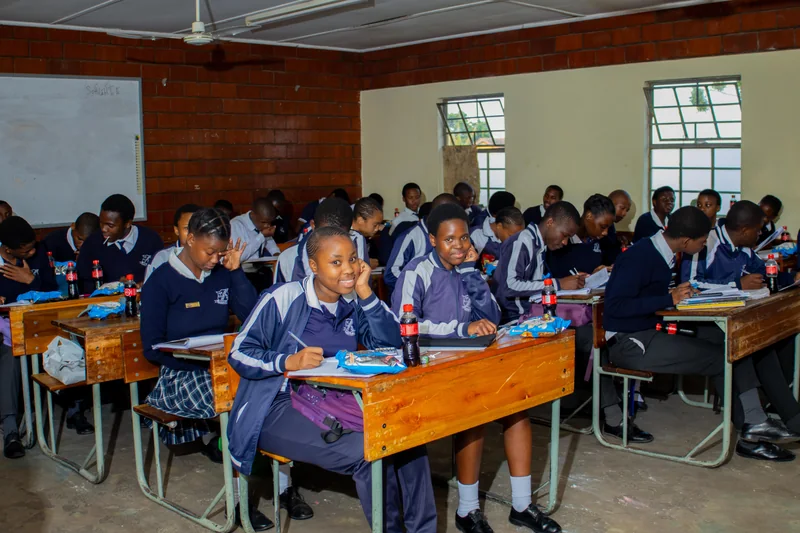 Learners seated at desks with learning materials during an EduCate session at Ntee High.