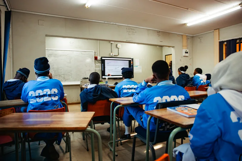 Learners seated at desks during an EduCate classroom session at Thuto-Kitso.