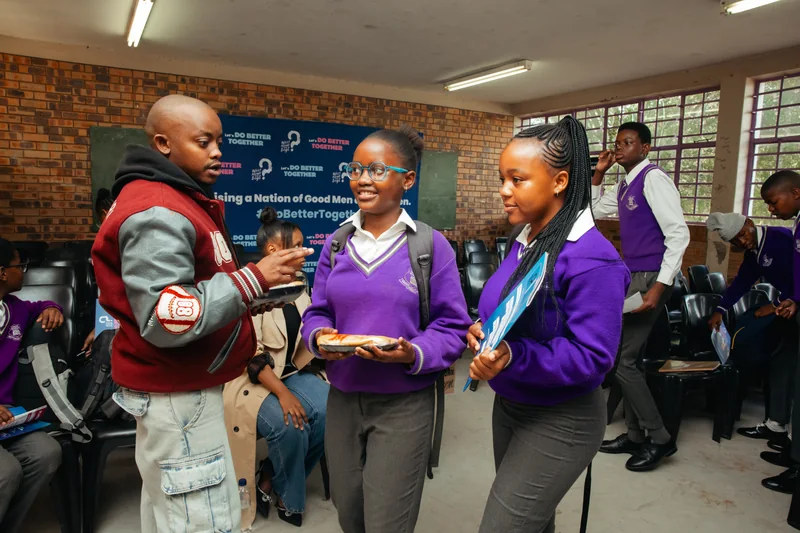 Learners engaging with a facilitator during WATB REDO at Fidelitas.